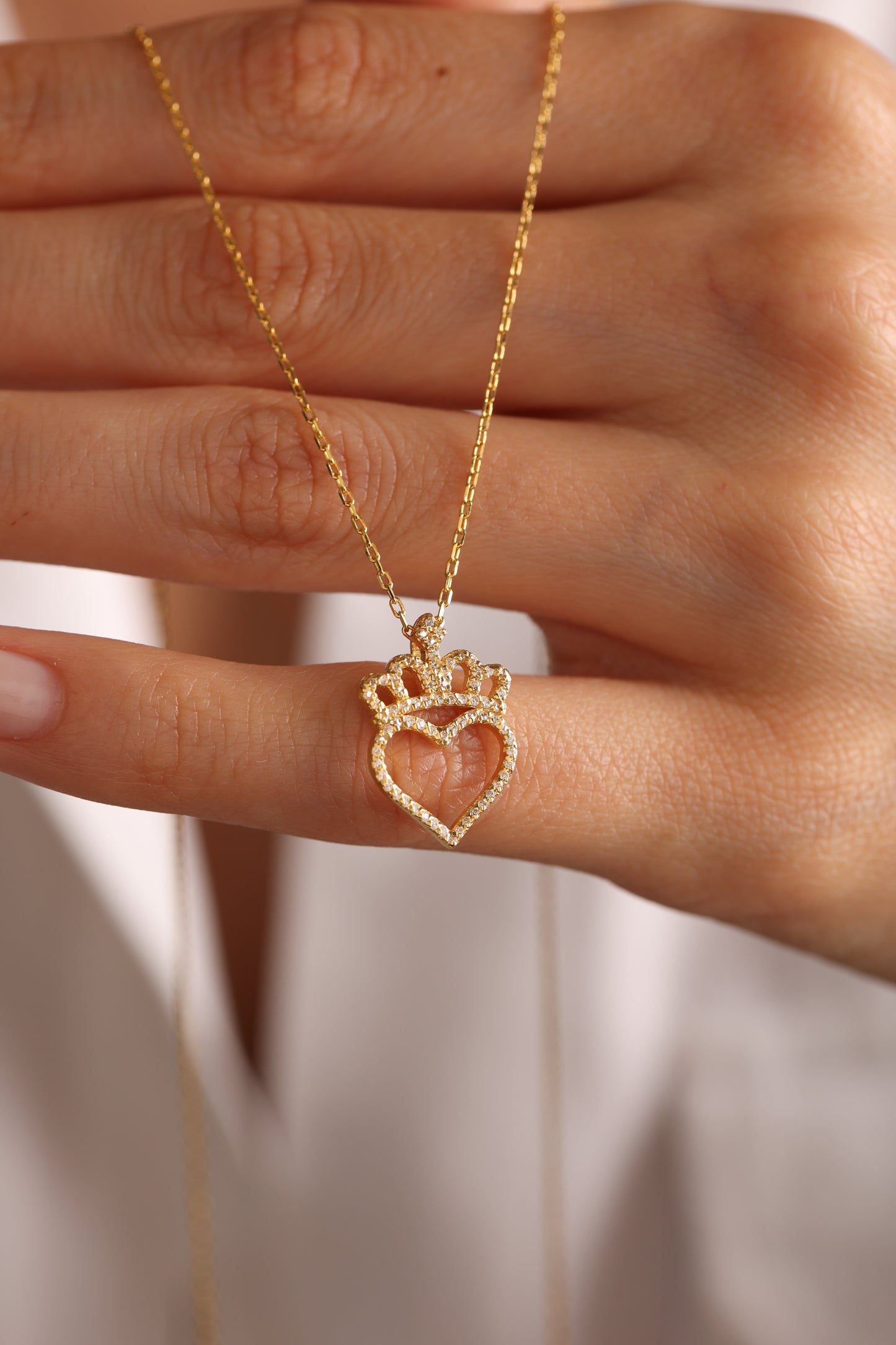 Heart, crown and stone pendant